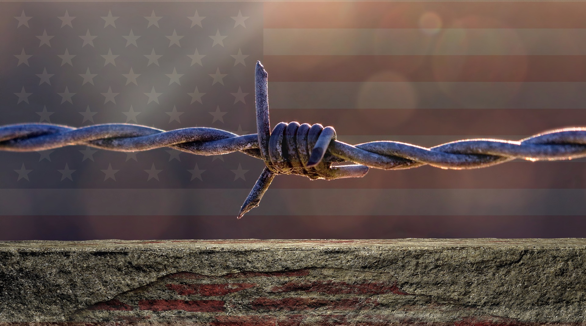 American Flag Behind Barbed Wire