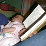 Steven Pecevich (father) reading to baby Sydni